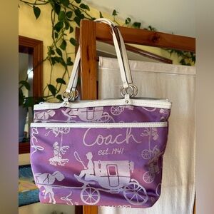 Coach tote bag featuring a "Horse and Carriage" print and white leather handles
